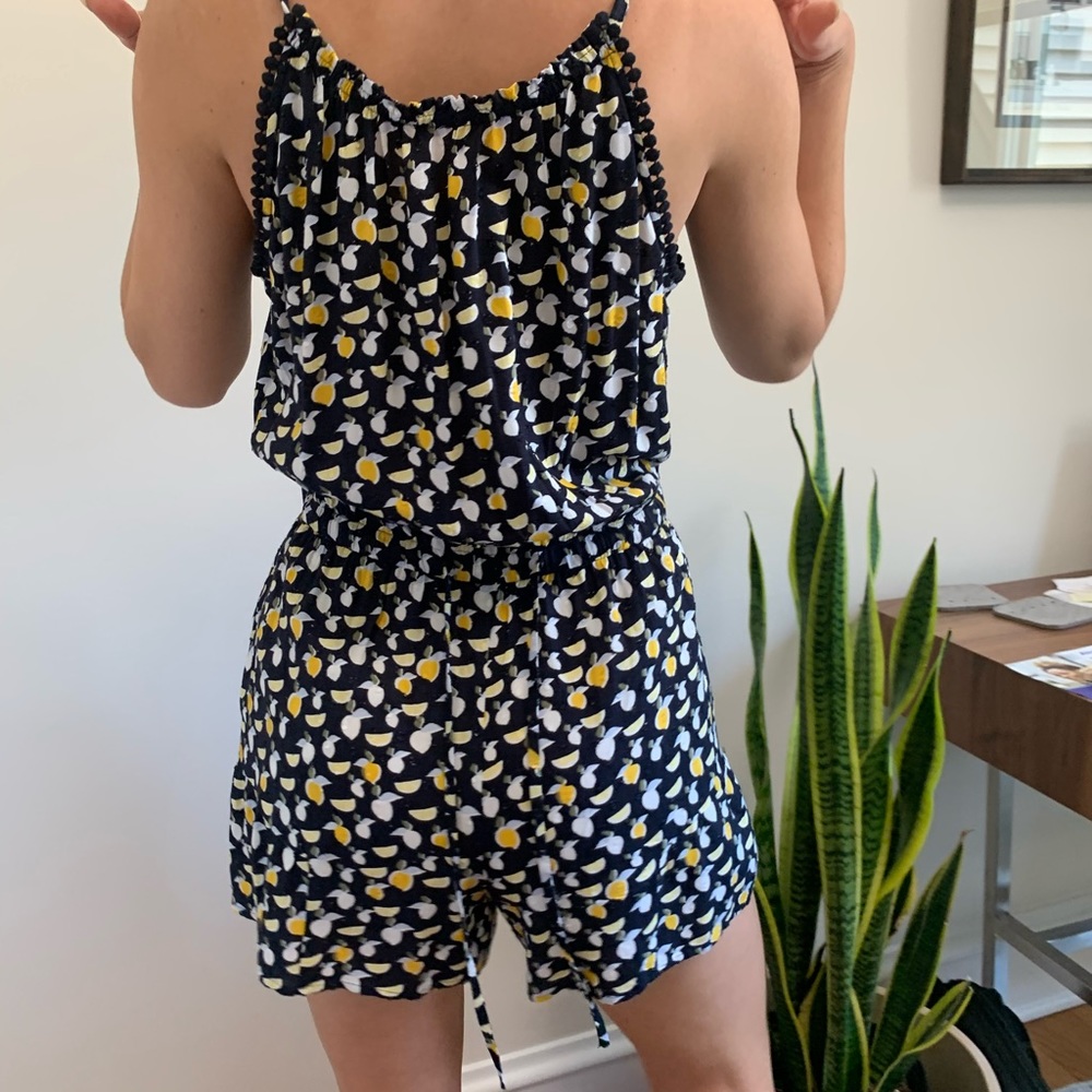 Black romper with lemon detailing. Tags still on.